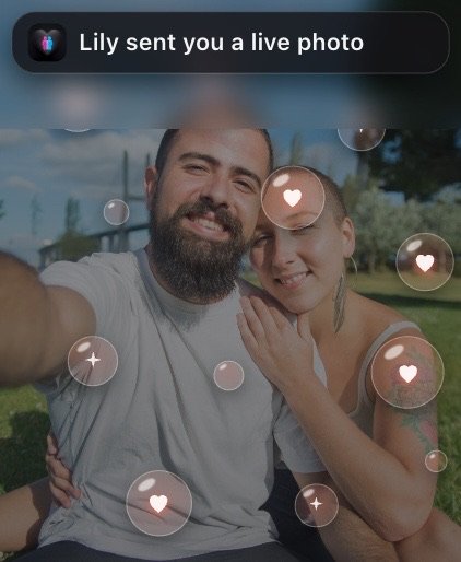 A live photo from Lily filling the screen with drifting hearts.